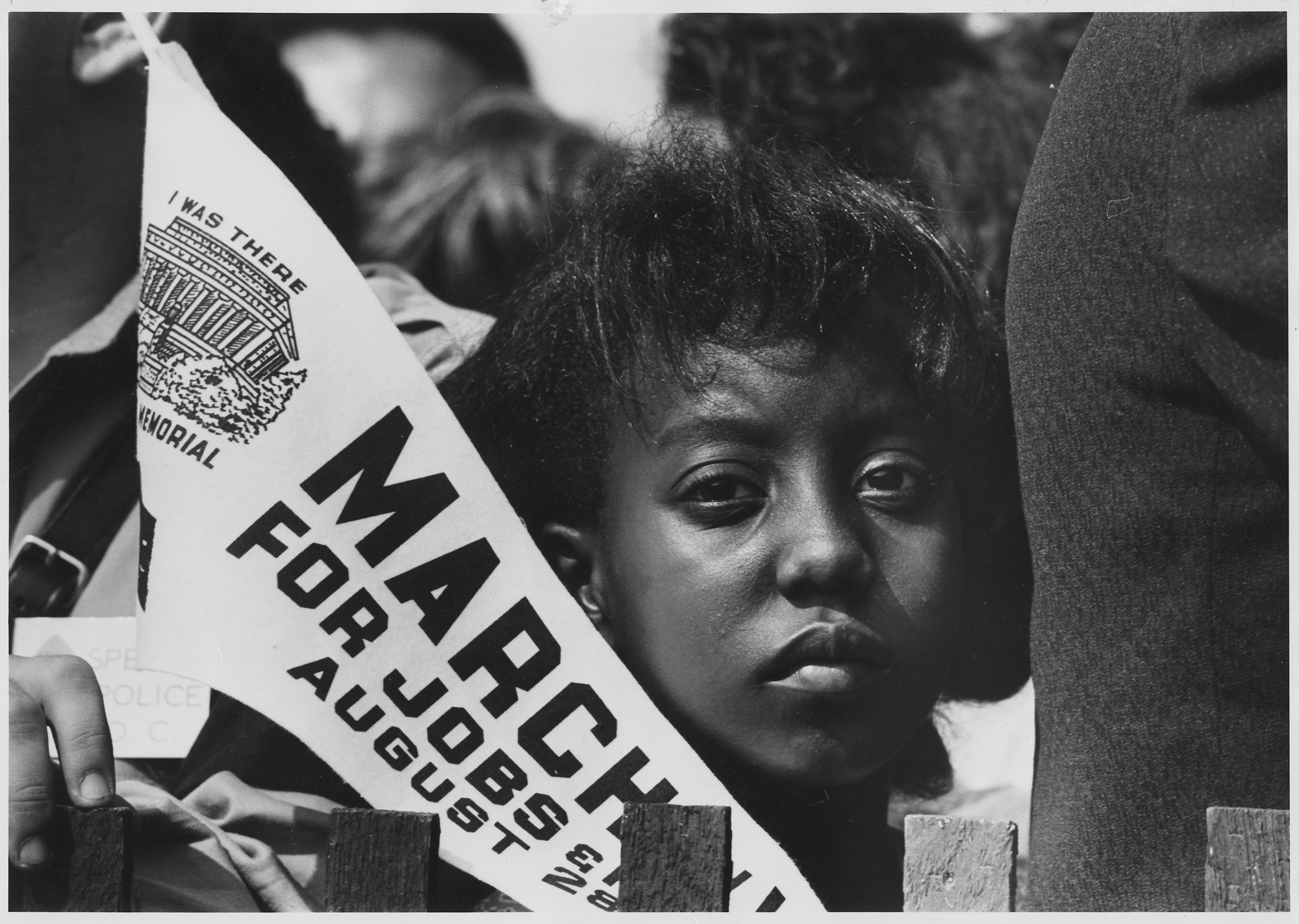 A young woman at the Civil Rights March on Washington, D.C. (1963) Photo credit: National Archives at College Park.